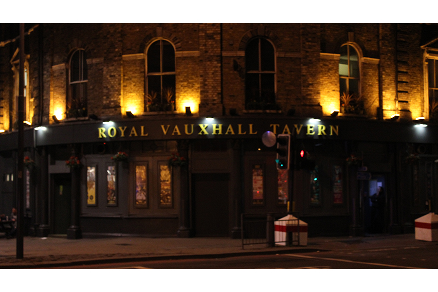 A view of the Royal Vauxhall Tavern, a brick building resembling a pub occupying the block. 