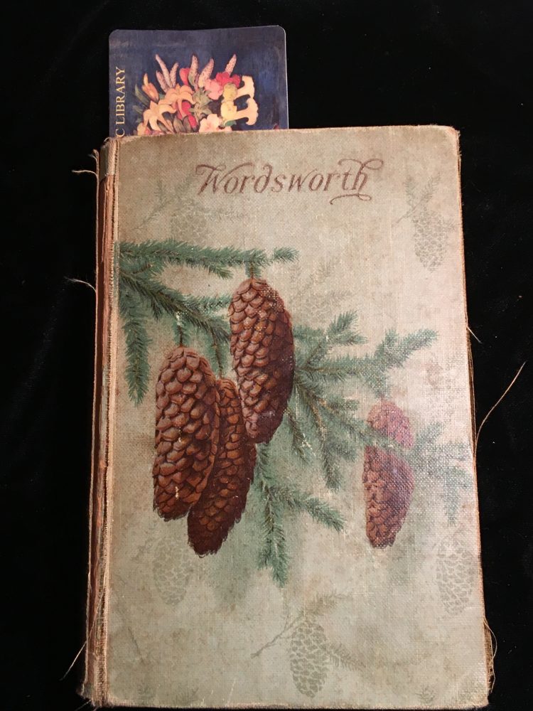 Poems of Wordsworth, with a faded library bookmark. 