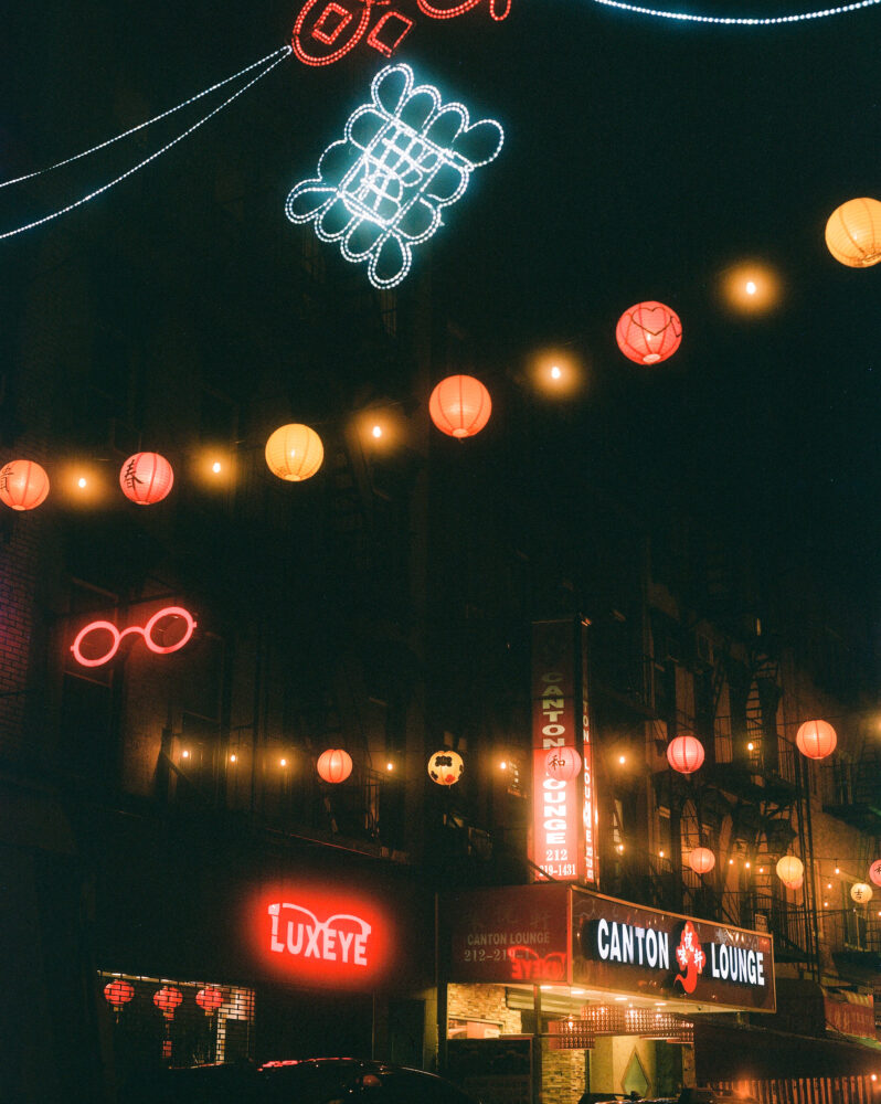 Photograph depicting hanging lights over a street