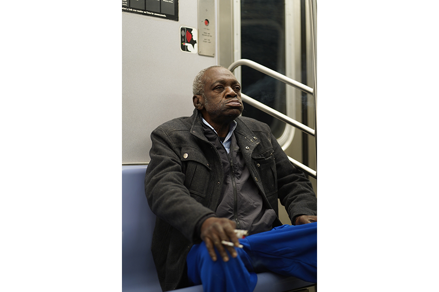 A man smoking on the subway