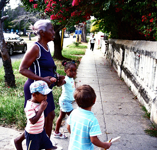 Black woman and three children. 