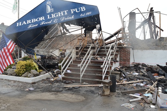 The damaged awning of "Harbor Light Pub"