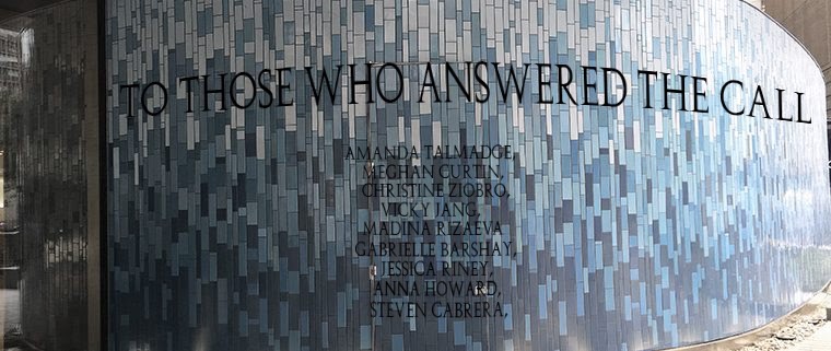 Blue tile wall on which names are inscribed