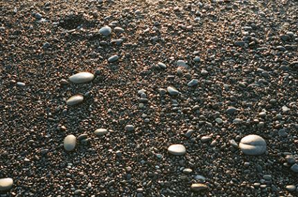Small rocks and sand on a pebble beach