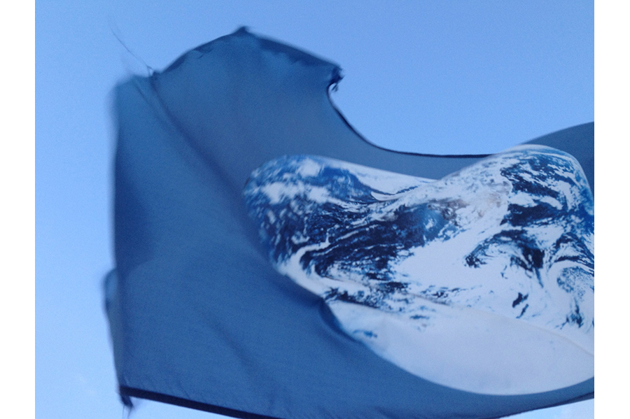 Close-up of an Earth flag flying in the wind.
