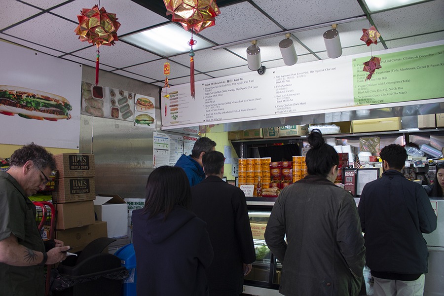 The deli interior, showing a crowd waiting at the counter