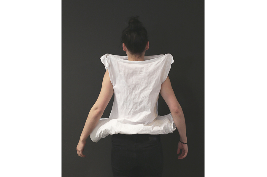 A back view of the stiffened t-shirt, visible as a triangular shape on a squared-off base. 