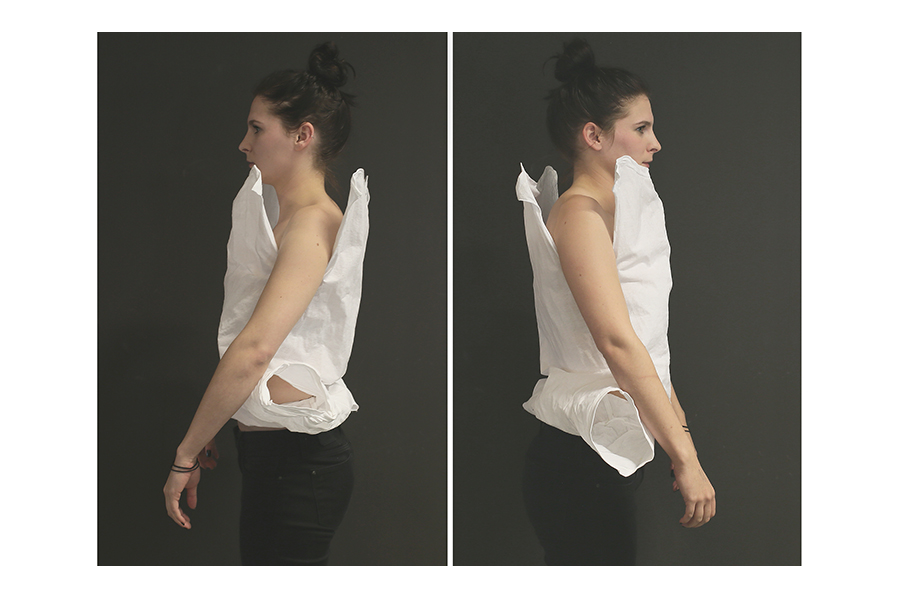 Two side views of the stiffened t-shirt, open shoulders and arms held at the model's side. 