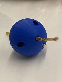 Ball Shaped Pen Holder to help people with low mobility hold on to their writing utensils.