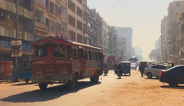 A Karachi street with a decorated bus