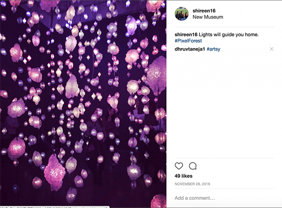 Screenshot of an Instagram post of a purple string lights up close. 