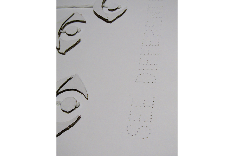 Close-up of the words "see differently" written in cut-out dots.