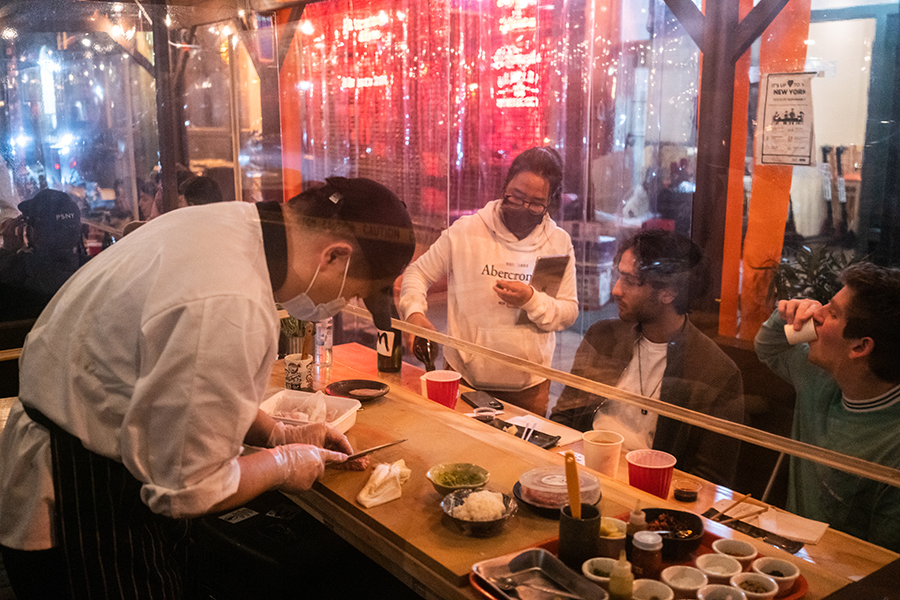 A sushi restaurant located in a foodshed; the chef prepares an Omakase meal for two. 