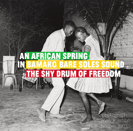 A man and a women dancing, with the superimposed text "an African spring in Bamako, bare soles sound the shy drum of freedom"