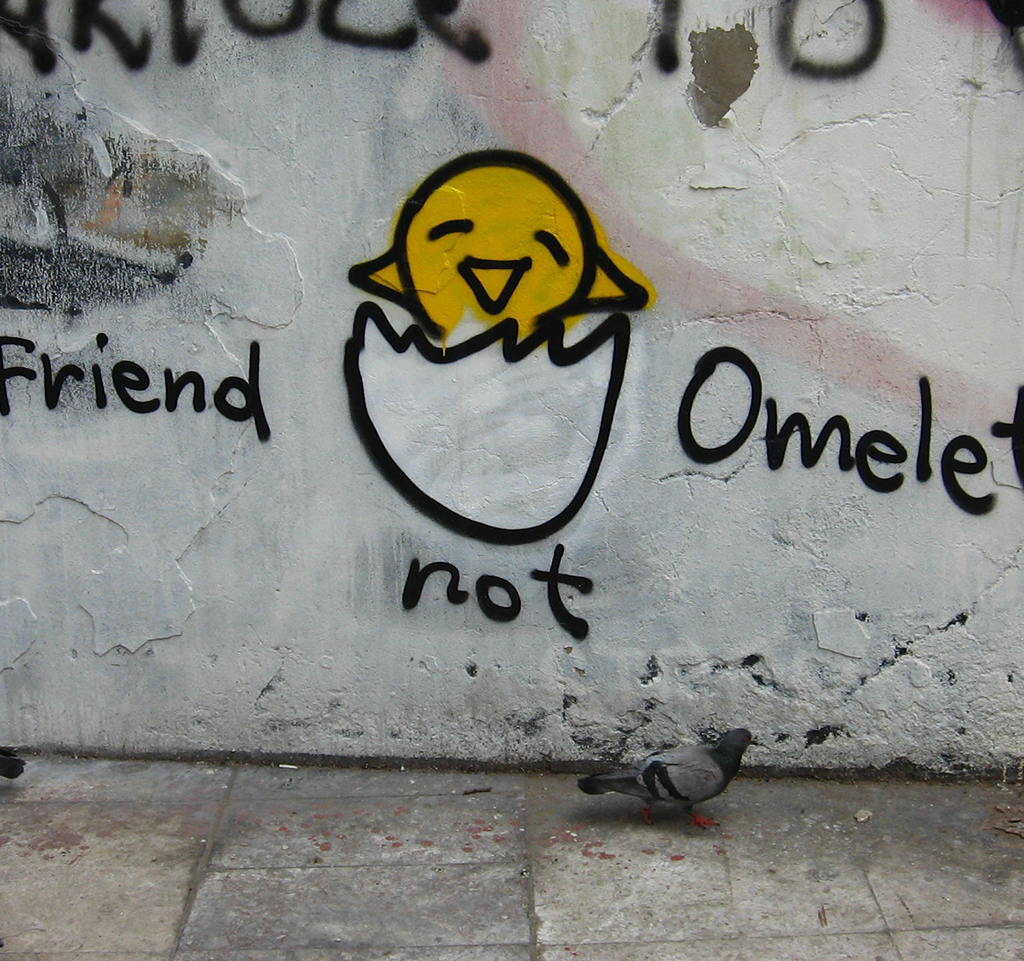 Graffiti of a chick, captioned "Friend not omelet"