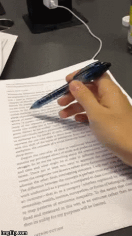Gif of a pen scribbling over a page of text