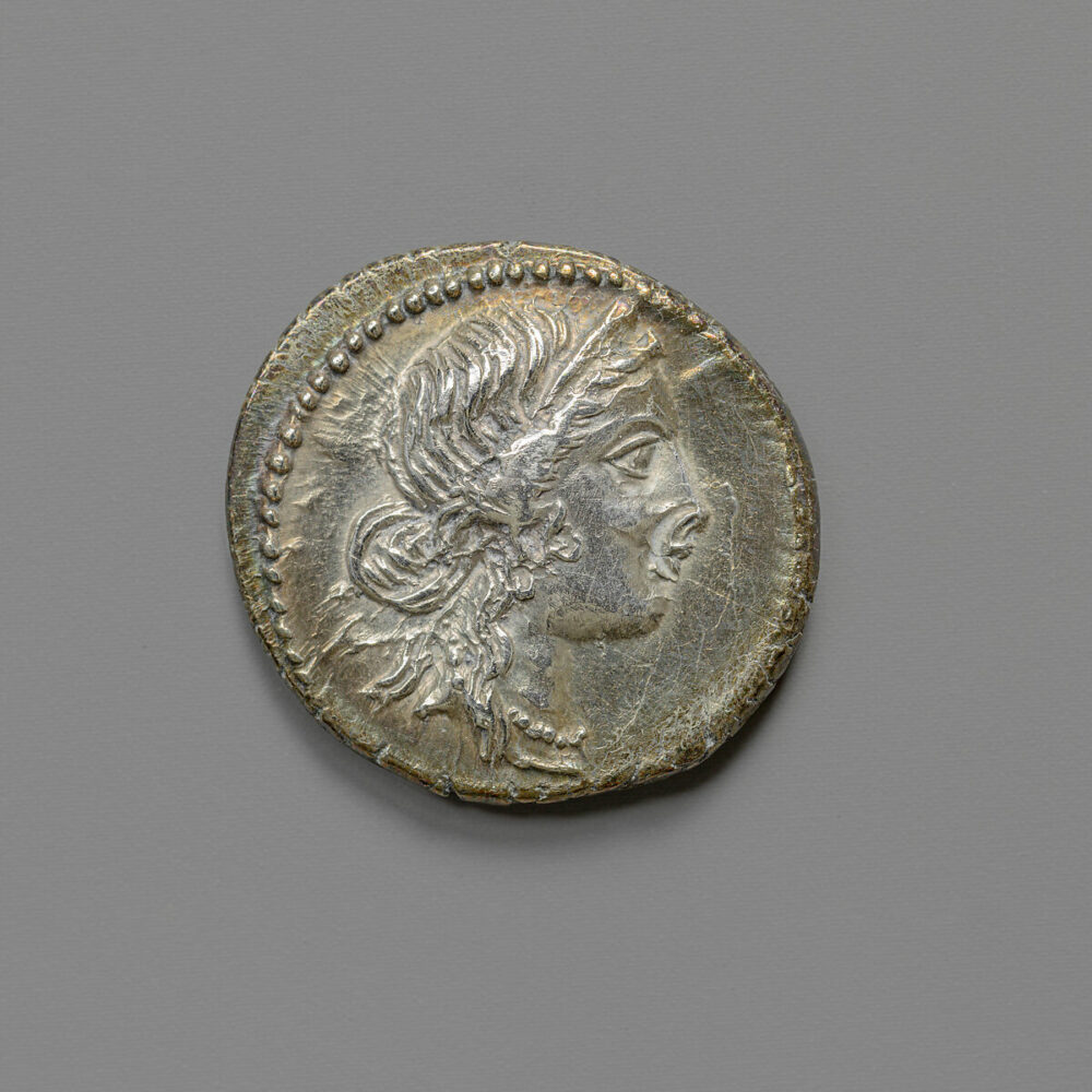 Silver coin showing head of Venus in profile 