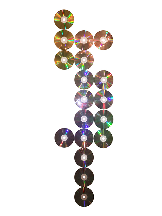 A number of CDs lined up in three uneven columns. 